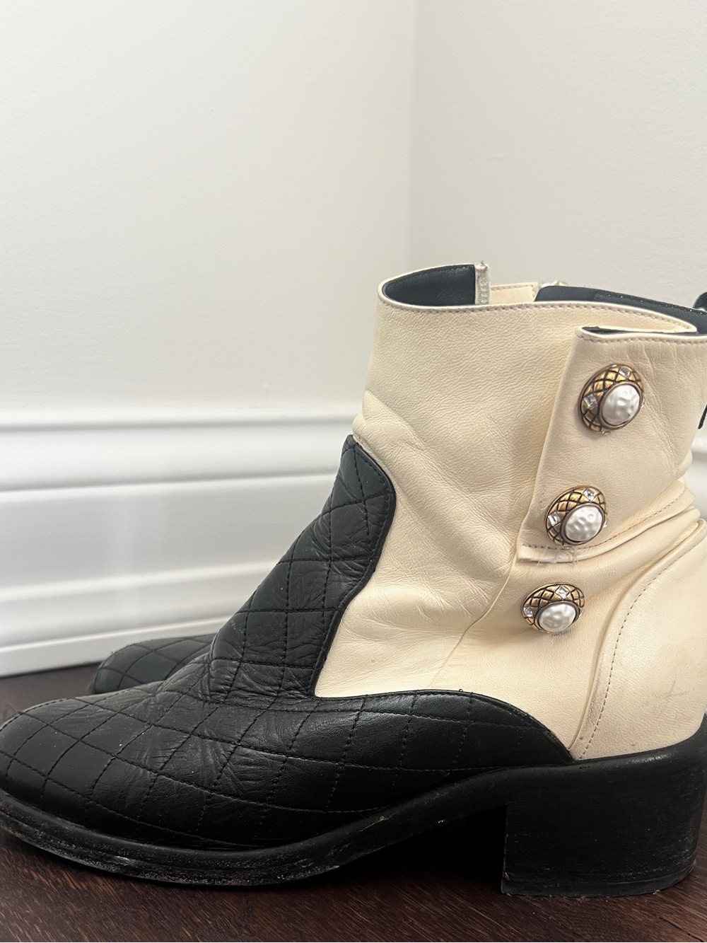 CHANEL Black & Cream Quilted Leather Ankle Boots with Pearl Buttons